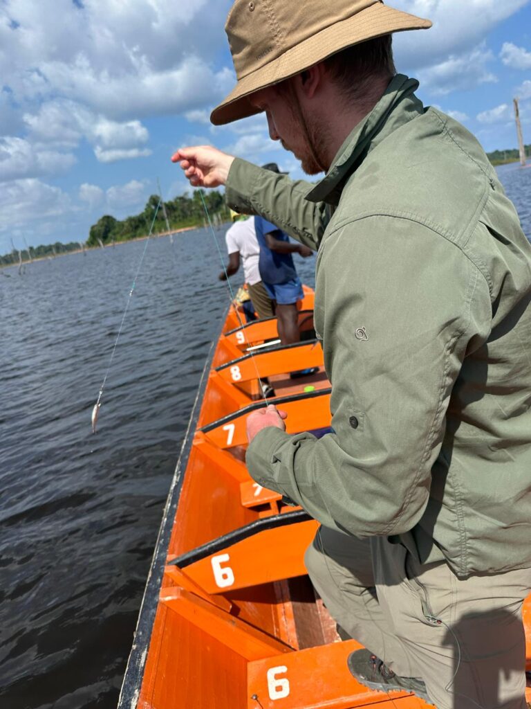 A man fishing from the boat